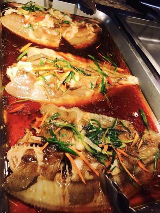 Fish fillets with ginger and scallions in a savory glaze